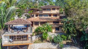 an aerial view of a house with palm trees at Casa Sonora - Ocean View in Carrillo