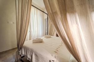 Ένα ή περισσότερα κρεβάτια σε δωμάτιο στο Casa Zarinelli