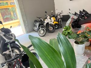 a group of motorcycles parked in a garage at MoHa Hotel in Hanoi
