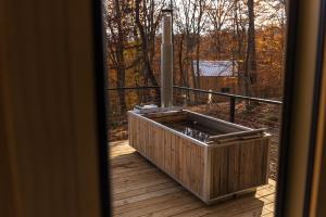 a balcony with a wooden box on a deck at The Ffern in Logan