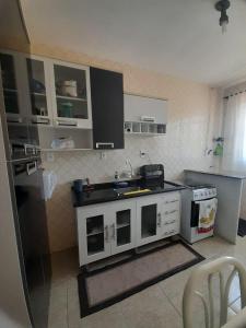 Køkken eller tekøkken på Apartamento Confortável em Serra Negra