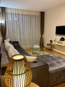 a living room with a couch and a table at Luxury in Sveti Vlas +3 photos