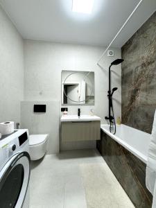 Ένα ή περισσότερα κρεβάτια σε δωμάτιο στο Apart Dolce Vita ЖК Great House