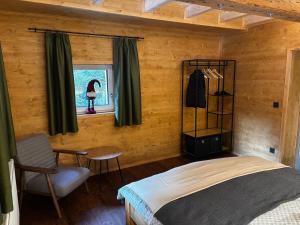 Ένα ή περισσότερα κρεβάτια σε δωμάτιο στο LostGarden Apartments