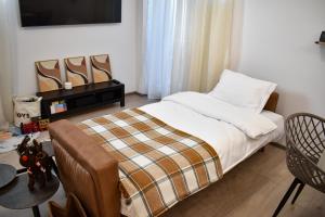 Ένα ή περισσότερα κρεβάτια σε δωμάτιο στο Aba Fly & Rest