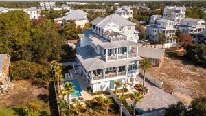 an aerial view of a large white house at Pomp in Paradise in Inlet Beach