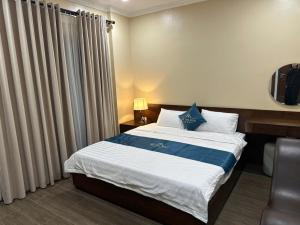 Ένα ή περισσότερα κρεβάτια σε δωμάτιο στο Thế Tùng HoTel