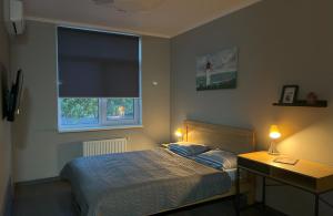 Postel nebo postele na pokoji v ubytování Green Apartments