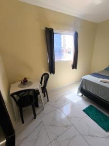 Ένα ή περισσότερα κρεβάτια σε δωμάτιο στο Suite da praia