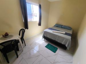 Ένα ή περισσότερα κρεβάτια σε δωμάτιο στο Suite da praia