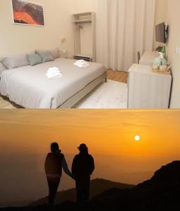 卡塔尼亚Etna Vibes Home的两人站在一个配有床的房间