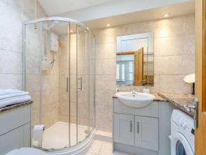 a bathroom with a shower and a sink at 3 Bed in Rowlands Gill 86802 in Stanley