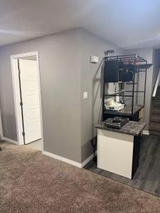 an empty room with a white wall and a door at DM Stays in Brandon