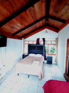 Ένα ή περισσότερα κρεβάτια σε δωμάτιο στο Hotel Victoria Atitlan