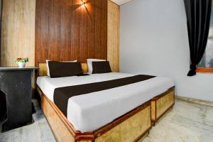Postel nebo postele na pokoji v ubytování HOTEL O STAY INN Lucknow Airport VIP Terminal + 21 fotografií
