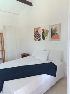 Una cama o camas en una habitación de Pousada Vila Mundi Itaúnas