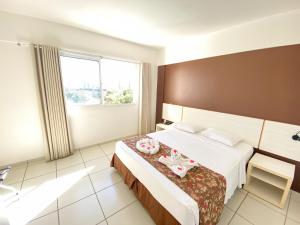 Ένα ή περισσότερα κρεβάτια σε δωμάτιο στο Apartamento Le Jardin +59 φωτογραφίες