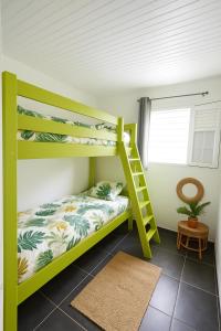 Ένα ή περισσότερα κρεβάτια σε δωμάτιο στο Lagon du Robert