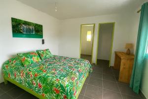 Ένα ή περισσότερα κρεβάτια σε δωμάτιο στο Lagon du Robert