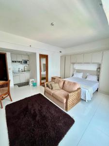 Giường trong phòng chung tại Tropical Executive Vista Ponta Negra