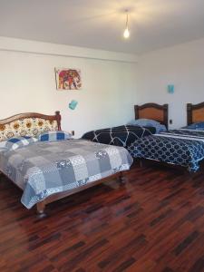 Ένα ή περισσότερα κρεβάτια σε δωμάτιο στο La Fábula-Amarilla +2 φωτογραφίες