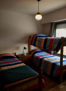 Ένα ή περισσότερα κρεβάτια σε δωμάτιο στο OLO Hostel & Bar Club VIEDMA