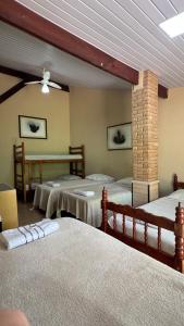 Postel nebo postele na pokoji v ubytování Chacara Descanso do Rei + 26 fotografií