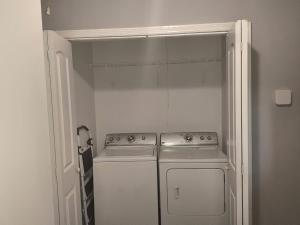 a kitchen with a stove and a dishwasher at Macon Duplex Getaway | 3BR, WiFi, BBQ & Parking in Riverside Park