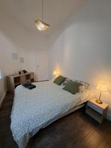 Ένα ή περισσότερα κρεβάτια σε δωμάτιο στο L'elegant hyper centre