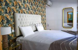 En eller flere senge i et værelse på Apartamento MARINA RESIDENCE + 11 billeder