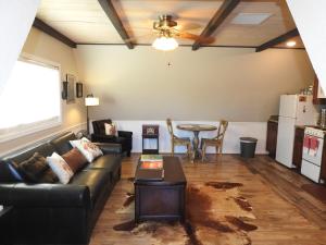 a living room with a couch and a table at Historic Gold Town Loft A-Frame 1 Bedroom with sofa sleeper WIFI in Julian
