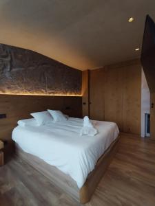 En eller flere senge i et værelse på Slalom luxury con vistas