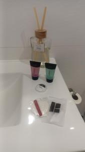 three different colored cups sitting on a white table at Bruma in Vilagarcia de Arousa