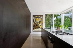 a kitchen with a stove and a window at Villa in the Heart of Aarhus in Aarhus