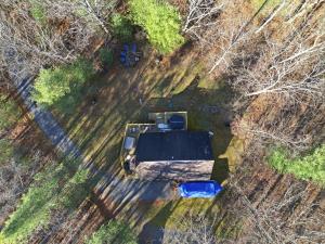 an aerial view of a van parked in a field at Family-Friendly Home w Hot Tub Fire Pit Games in North Glade