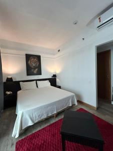 En eller flere senge i et værelse på Tropical VIsão da Ponta Negra