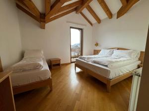 Ένα ή περισσότερα κρεβάτια σε δωμάτιο στο HC Hotel Garni - Rooms and Apartments +12 φωτογραφίες