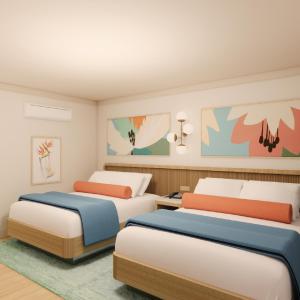 a rendering of a bedroom with two beds at Pavilion Hotel in Avalon