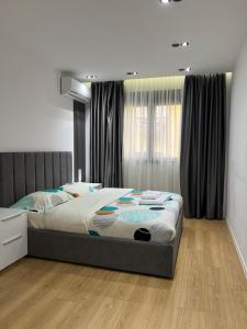 Ένα ή περισσότερα κρεβάτια σε δωμάτιο στο Enzo Rooms Center