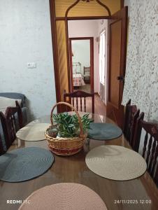 a table with four plates and a basket on top at La casita in Medellín