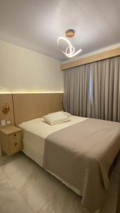 Ένα ή περισσότερα κρεβάτια σε δωμάτιο στο Casa Charmosa