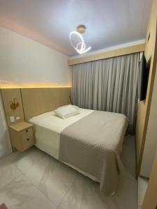 Ένα ή περισσότερα κρεβάτια σε δωμάτιο στο Casa Charmosa