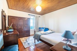 En eller flere senge i et værelse på GuestReady - Faia House