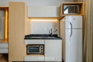 Nhà bếp/bếp nhỏ tại Sua estadia próxima da Praia Brava - BSO +139 ảnh