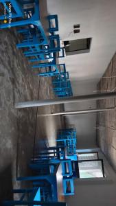 a row of blue stairs in a building at Mystic Resort Dublagadi in Balasore