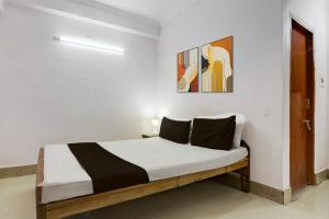 Ένα ή περισσότερα κρεβάτια σε δωμάτιο στο Hotel O Welcome Palace