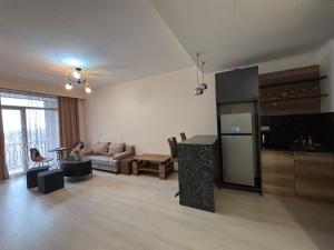 a living room with a couch and a table at Alvina Complex s in Tsaghkadzor