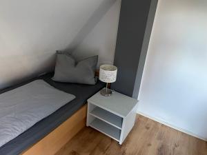 En eller flere senge i et værelse på 2 Zimmer Appartment