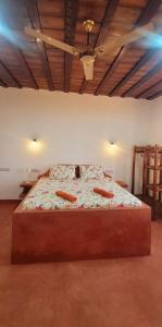 a bedroom with a large bed with two pillows at Villa-Katerima-paje zanzibar in Kiganga