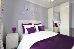 Ένα ή περισσότερα κρεβάτια σε δωμάτιο στο Djanea Luxury Apartment - Disneyland Paris